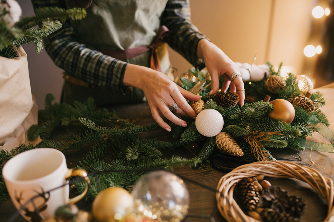 Festive Christmas flower arrangements and greenery decorating a home for the holiday season